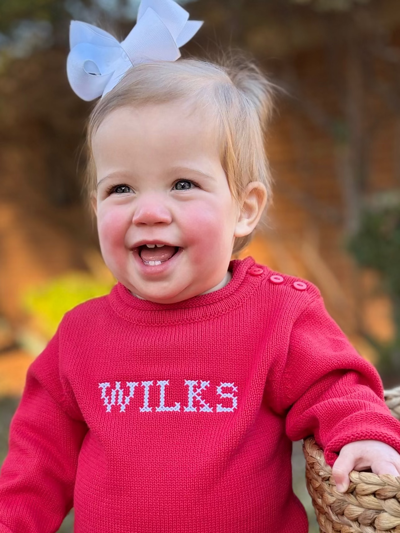 Red rollneck sweater with crossstitch font